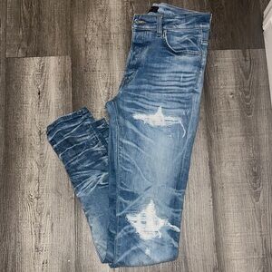 AMIRI Blue Distressed Skinny Jeans